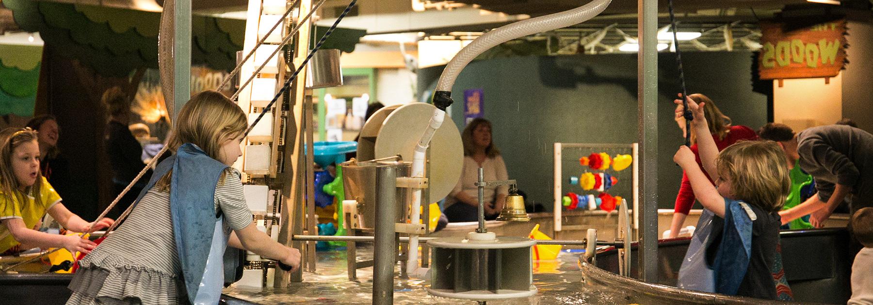 Children interacting with educational activities in the Children's Museum